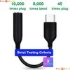 The image shows a USB-C to 3.5mm audio adapter and highlights its durability with text overlays indicating plug and bend test counts. Produktbild-Vorschau