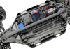 Close-up view of the underside of an RC car chassis, showing the motor, electronic speed controller, and servo. Náhľad obrázku produktu