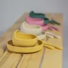 A row of baby bowls and spoons in various colors. Náhľad obrázku produktu