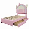 A pink unicorn-themed children's bed with LED lighting and two storage drawers, shown against a white background. Produktbild-Vorschau