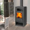 A cozy living room scene with a wood-burning stove, a dining table, and bookshelves. Produktbild-Vorschau