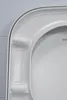 A close-up view of the edge of a white toilet seat. Produktbild-Vorschau