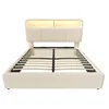 A beige upholstered bed frame with a slatted mattress support and an illuminated headboard. Náhled obrázku produktu