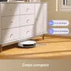 A robot vacuum cleaner is shown cleaning under a white dresser. Text overlays provide dimensions. Produktbild-Vorschau