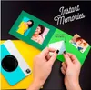 A person is shown using a Kodak instant camera to print photos and place them into a scrapbook. The scrapbook has a green cover with cutouts for photos. Anteprima dell’immagine prodotto