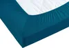 A close-up view of a teal fitted sheet on a mattress. Produktbild-Vorschau