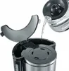 Water being poured into a coffee maker. Anteprima dell’immagine prodotto