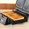 A close-up shot of a KRUPS sandwich maker with two sandwiches inside. Podgląd zdjęcia produktu
