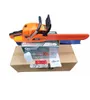 A new orange and black chainsaw is displayed on top of its packaging box, with accessories scattered around. Produktbild-Vorschau