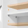 Close-up view of shelves being installed in a cabinet. Produktbild-Vorschau