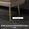 A close-up view of the legs and bottom of a beige upholstered bench, resting on a striped carpet. Anteprima dell’immagine prodotto