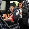 A mother and child in a car, with the child in a car seat. Produktbild-Vorschau
