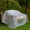 A transparent tarp covers a wooden bench in a garden setting. Anteprima dell’immagine prodotto