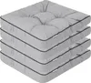 A stack of four grey seat cushions with black piping. Náhled obrázku produktu