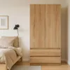 A bedroom scene with a wardrobe and bed. Voir les images du produit