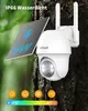 A white solar-powered security camera mounted on a tree trunk, with a solar panel attached. Náhled obrázku produktu