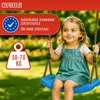 A young girl is happily swinging on a blue swing in a park-like setting. Anteprima dell’immagine prodotto