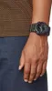 A close-up shot of a person's wrist wearing a black Casio G-Shock watch. Produktbild-Vorschau