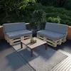 Outdoor patio furniture set made of wooden pallets with gray cushions, a coffee table, and a rug. Produktbild-Vorschau