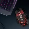 A gaming mouse and part of a keyboard are shown on a dark surface. Podgląd zdjęcia produktu