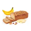 A loaf of banana bread with slices cut off, accompanied by bananas and walnuts. Podgląd zdjęcia produktu
