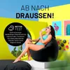 A woman in a bikini sits on a black beanbag chair, eating an ice cream, with colorful artwork on the wall behind her. Náhľad obrázku produktu