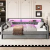 A daybed with LED lighting and a pull-out trundle bed is shown in a bedroom setting. Anteprima dell’immagine prodotto