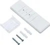 A white remote control with buttons, a clear plastic bracket, two screws, and two plastic wall anchors are arranged on a white background. Produktbild-Vorschau