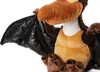 A close-up shot of a plush toy dinosaur with black wings. Podgląd zdjęcia produktu