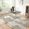 A dining set with a rectangular table and four chairs in a well-lit room with a large window. Anteprima dell’immagine prodotto