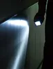 A person is holding a flashlight in a dark environment, illuminating a metallic surface. Anteprima dell’immagine prodotto