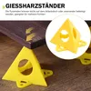 Yellow pyramid stands supporting a wooden surface, with a close-up inset of one stand. Produktbild-Vorschau