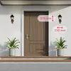 A front view of a wooden door with two wall-mounted lanterns and potted plants on either side, with measurement overlays. Produktbild-Vorschau