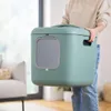 A person is holding a green cat litter box. Anteprima dell’immagine prodotto