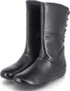A pair of black leather boots on a white background. Produktbild-Vorschau