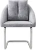 A studio shot of a gray upholstered chair with chrome legs. Náhľad obrázku produktu