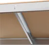 A close-up view of the internal structure of a shelving unit, showing metal support beams and particleboard shelves. Produktbild-Vorschau