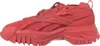 A side view of a red Reebok sneaker. Voir les images du produit