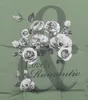 A floral arrangement with the words 'Lovely Romantic' superimposed over a large ampersand symbol. Produktbild-Vorschau