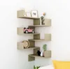 A corner shelf unit with various decorative items. Náhľad obrázku produktu