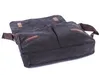 A dark gray canvas messenger bag with brown faux leather accents is shown from a slightly elevated side angle against a white background. Podgląd zdjęcia produktu