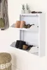 A white shoe cabinet with two shelves, displaying various shoes and boots. Podgląd zdjęcia produktu