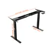 A black adjustable standing desk frame is shown against a white background, with dimensions indicated by orange lines and text. Podgląd zdjęcia produktu