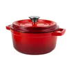 A red enameled cast iron pot with a lid and handles, isolated on a white background. Produktbild-Vorschau