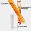 Two test tubes with liquids, one white and one orange, with text labels indicating ingredients. Podgląd zdjęcia produktu