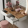A vanity table with makeup and accessories, set up in a room with natural light. Produktbild-Vorschau