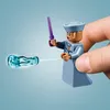 A Lego minifigure holding a wand and casting a spell on a blue translucent object. Náhled obrázku produktu