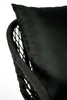 A close-up of a black chair with a black cushion. Produktbild-Vorschau