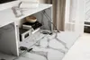 A close-up view of an open cabinet door on a marble-effect TV stand, showing internal storage and a lift mechanism. Voir les images du produit