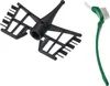 A black mixing attachment and a green cleaning brush are displayed against a white background. Produktbild-Vorschau